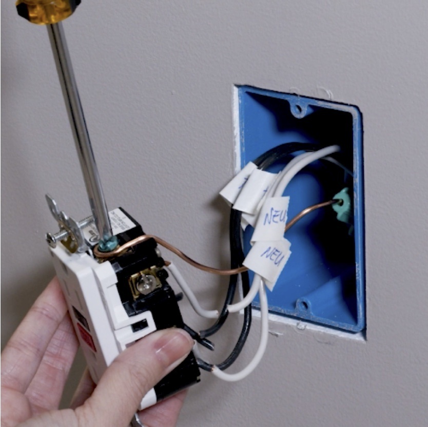 detaching of existing outlet during GFCI USB outlet installation