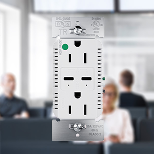  outlet with blurred background of three people sitting in airport