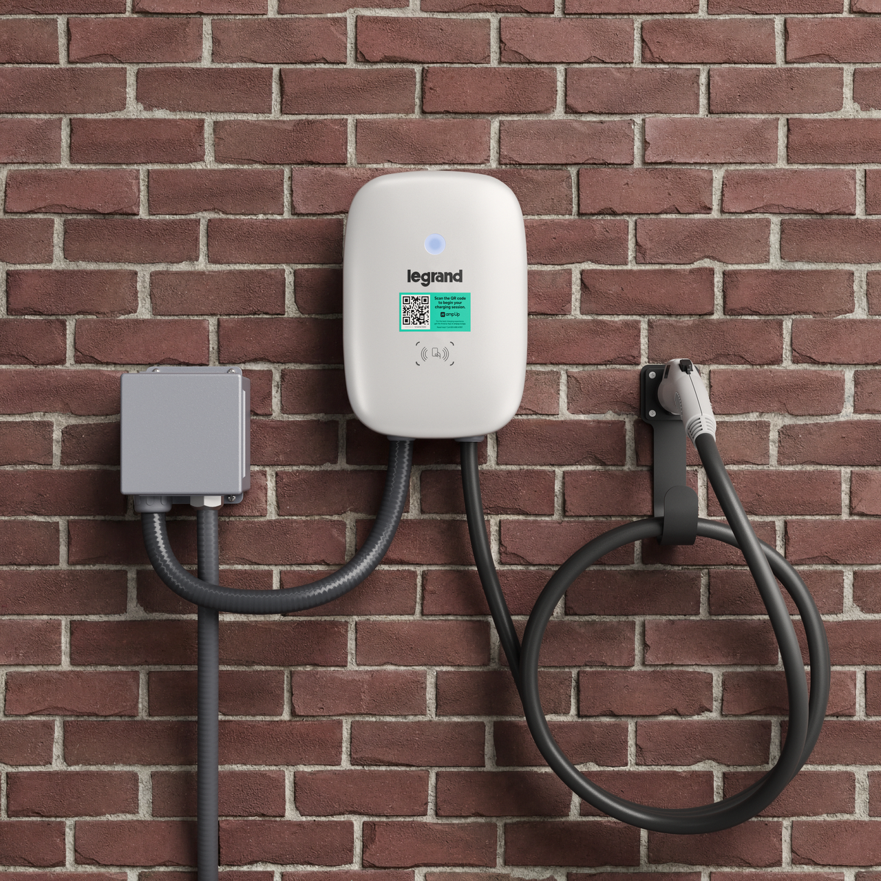Networked EV Charger on brick wall with everything that comes with the unit included (aside from junction box)