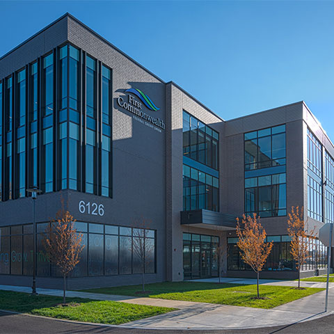 exterior of gray building against blue sky