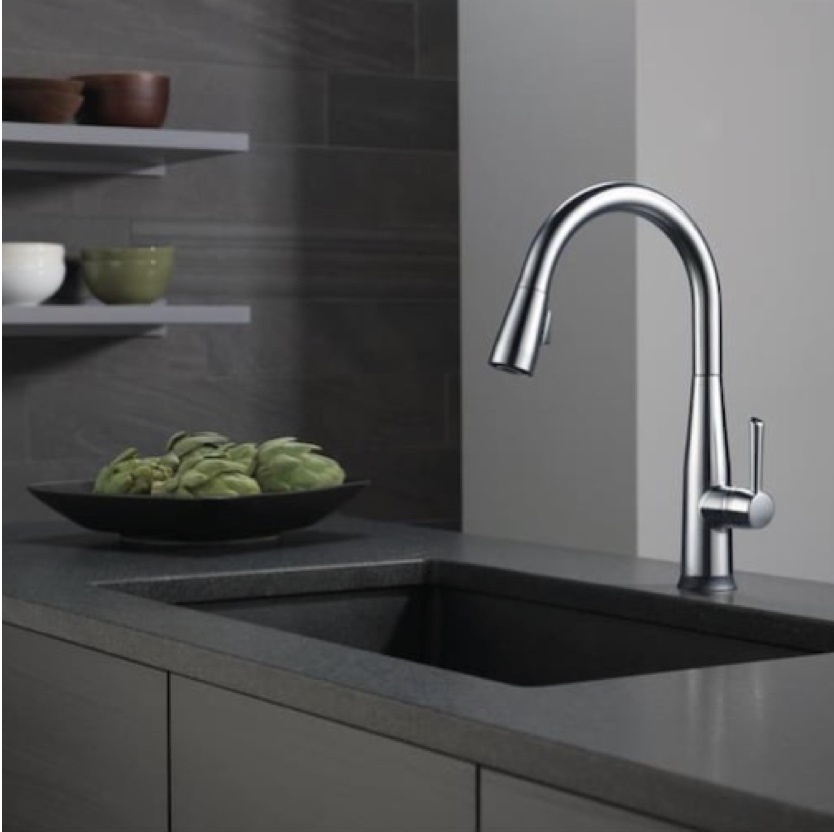 modern kitchen faucet with dark counter tops