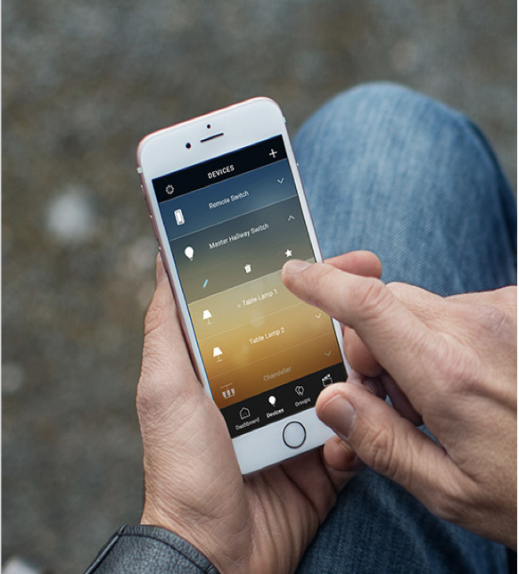 hands holding smart phone with Legrand Smart Lights app on display