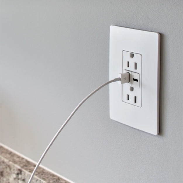 close up of radiant usb outlet with one cord plugged in