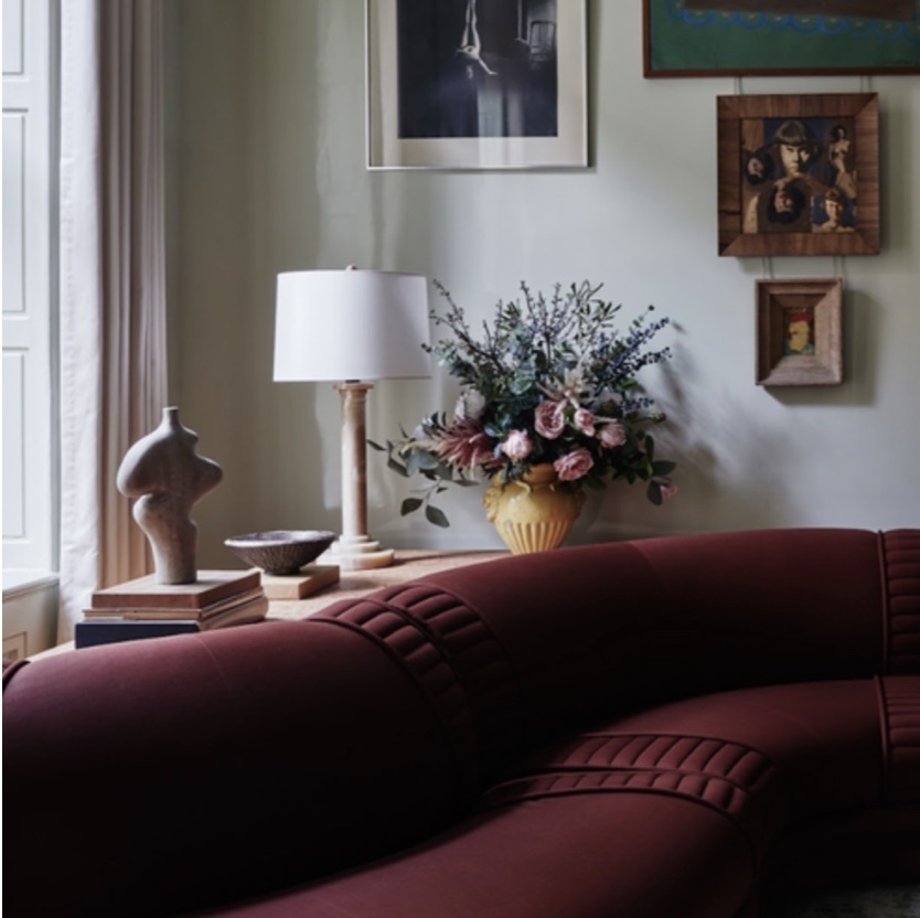 Residential sitting area interior with burgundy furniture accents
